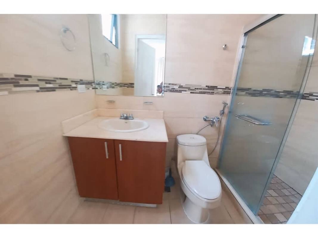 Modern bathroom with glass shower, vanity unit and tiled walls PH San Francisco Bay Panama City