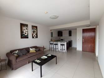 Kitchen with breakfast bar and modern finishes in PH Midrise apartment Panama Pacifico