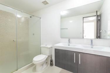 Bedroom with large window and bright lighting PH Midrise apartment Panama Pacifico