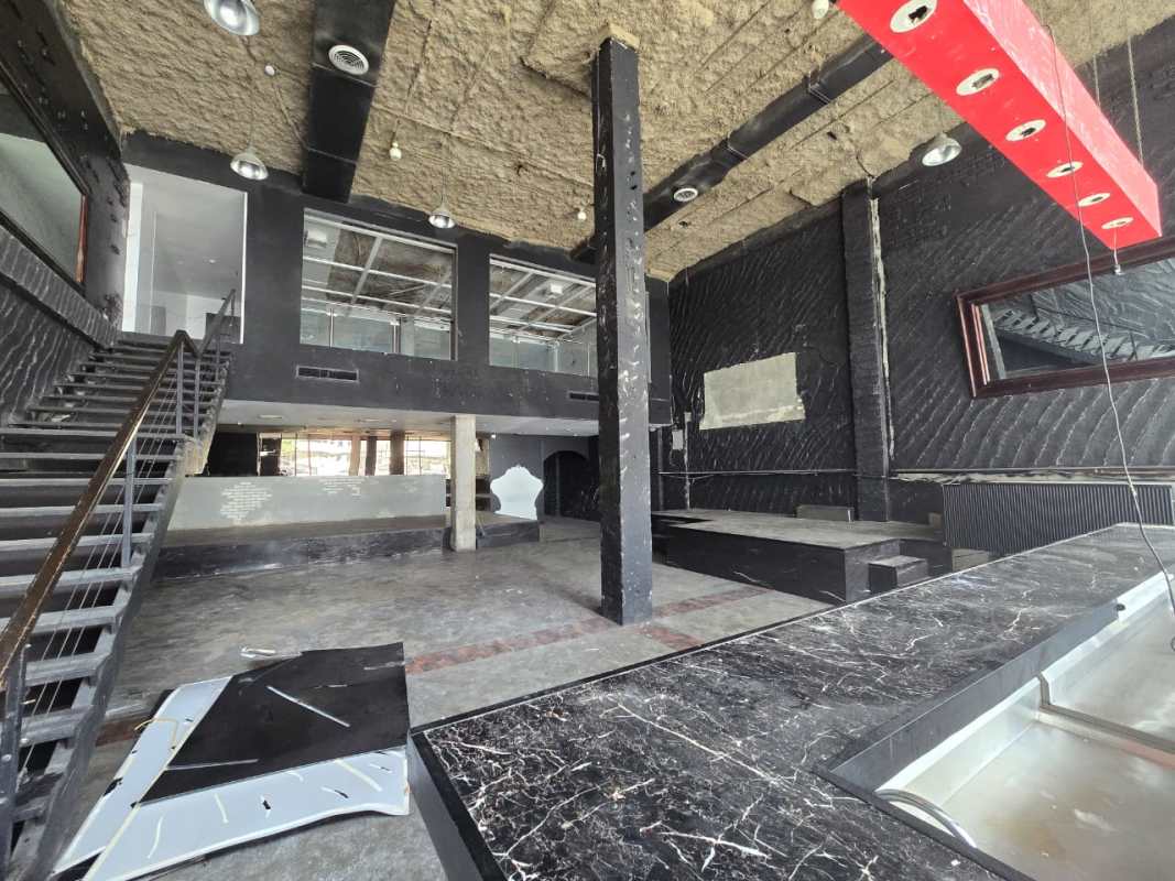 Spacious commercial interior with marble bar counter, glass windows and exposed ceiling available for rent in Obarrio Panama