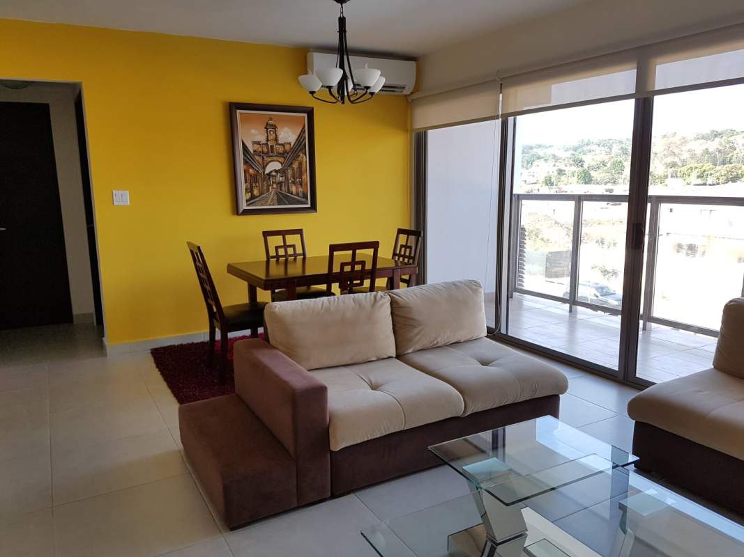 Open living and dining space with balcony access and bright natural light PH Midrise Woodlands Panama
