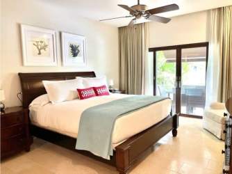 Spacious master bedroom with ensuite bath and lagoon views in luxury Buenaventura villa Panama