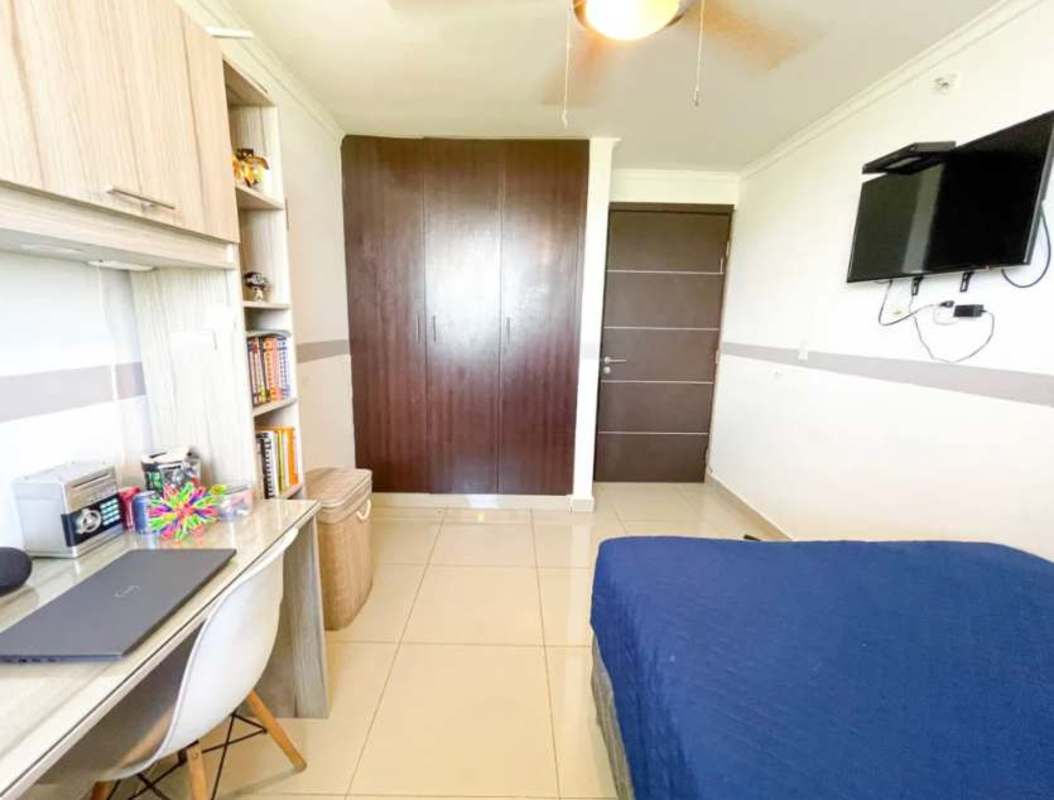 Master bedroom furnished with large window city view PH Portofino Tower Panama