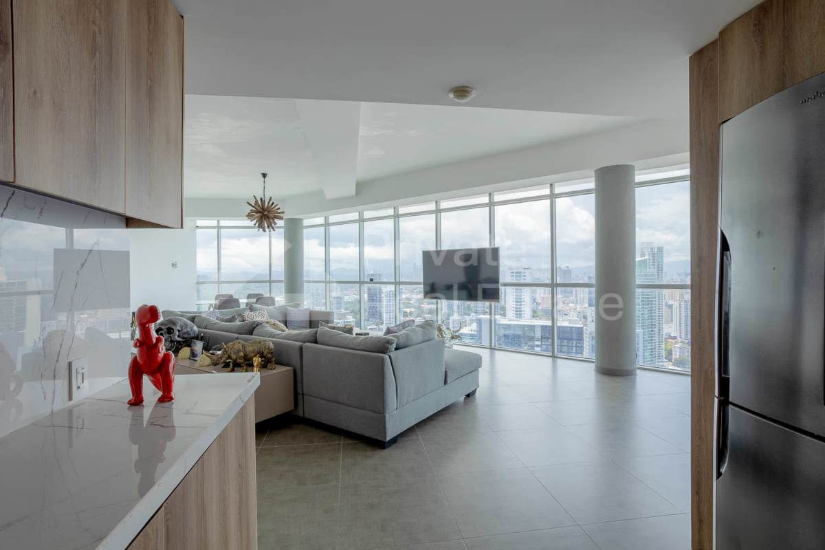 Spacious modern living room with floor-to-ceiling windows and ocean skyline view in PH Yacht Club Tower Panama City