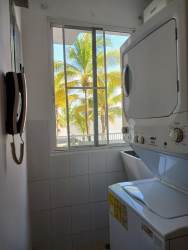 Modern living room with access to sea view balcony at PH Altamarina Playa Dorada Panama