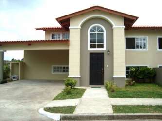 Modern contemporary home with carport and landscaped front yard in Arraijan Panama