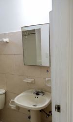 Minimalist bathroom with pedestal sink and mirror cabinet in Arraijan Panama