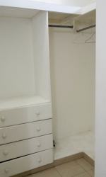 Small interior room with desk and air conditioning unit in Panama Oeste furnished rental