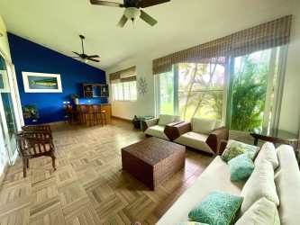 Covered patio outdoor bar and grill area next to pool Punta Barco Village beach home
