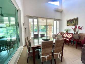 Granite countertop kitchen with breakfast bar wood cabinets in beach house Punta Barco Panama