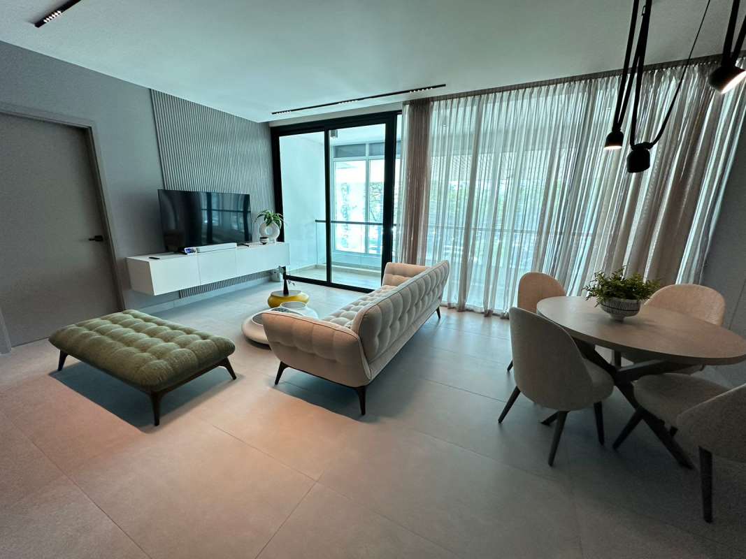 Spacious living dining room with glass doors to balcony in PH Uptown Calle Uruguay Panama City