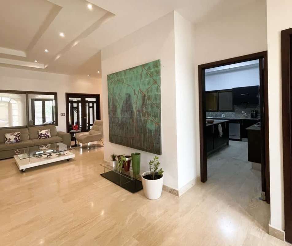 Spacious living dining with marble floors and large windows luxury home Costa Sur Panama City