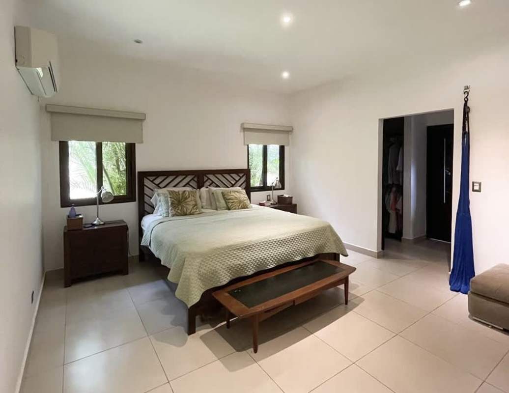 Modern home office with garden view window in Costa Sur luxury home Panama City