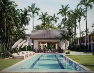 Resort-style swimming pool with lounge chairs and palm trees in Punta Chame Villas