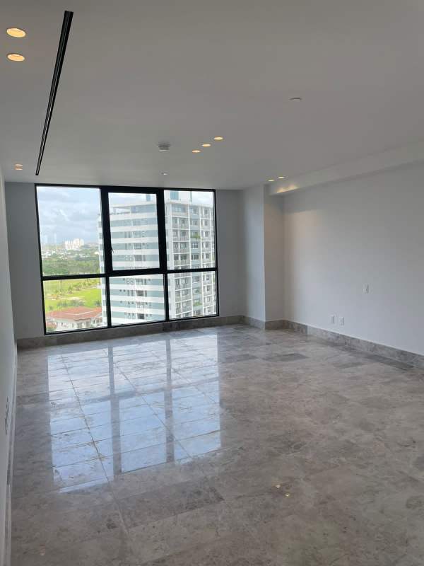 Large unfurnished living space with marble floors, balcony access, floor-to-ceiling windows, PH Empire Residences Panama