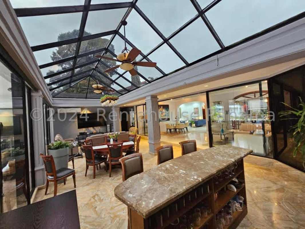 Spacious modern kitchen featuring granite island, stainless steel appliances, and Italian cabinetry in Altos del Golf Panama City