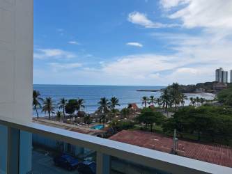 Living room with floor-to-ceiling windows ocean view Playa Gorgona Panama