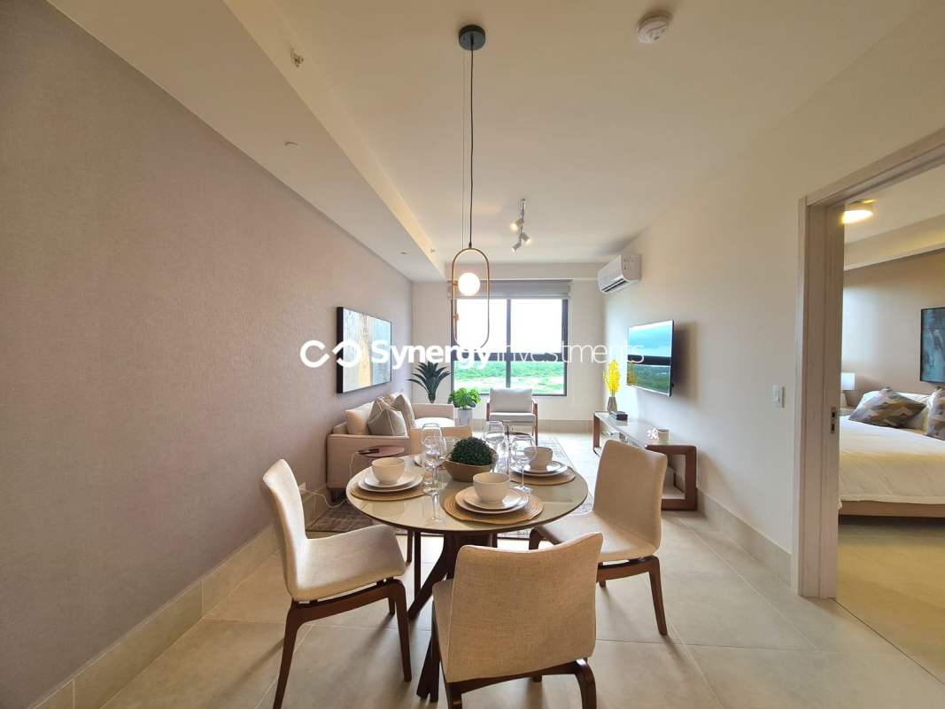 Resort-style infinity pool and sun deck with views of golf course in Santa Maria Golf & Country Club Panama City