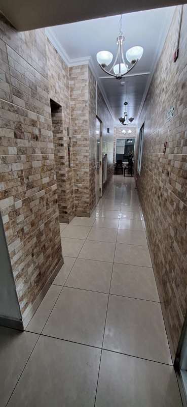 Bright hallway with AC, tiled floor, white walls in PH Prisma Parque Lefevre Panama