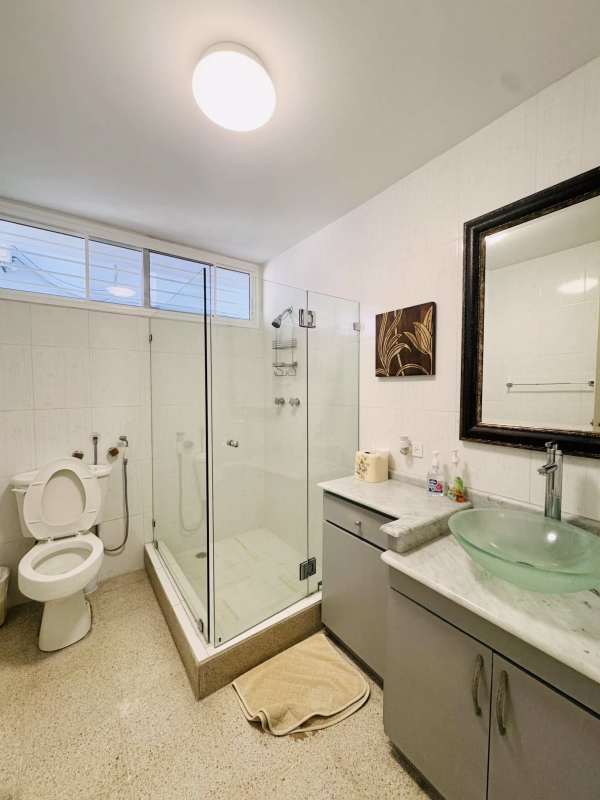 Hallway with tile floors, artwork and modern lighting in Panama apartment for sale