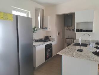 Open kitchen with breakfast bar and stainless appliances beach house in Punta Chame Panama