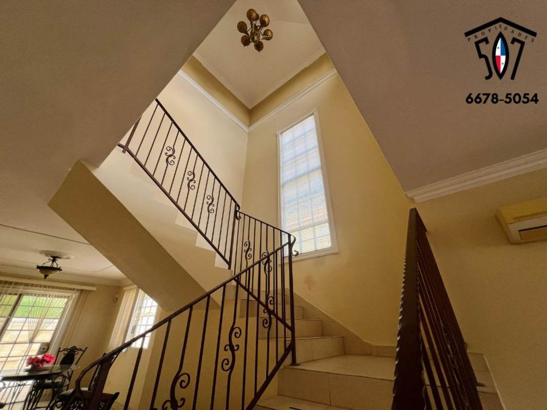 Entrance hall with staircase in Golden Springs Condado del Rey Panama house for sale