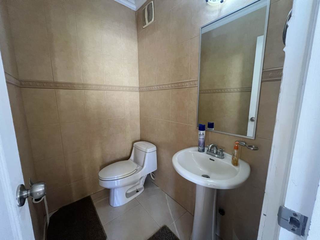 Spacious kitchen with granite counters and wooden cabinets Golden Springs Panama