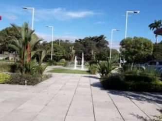 Empty commercial office with large windows, tiled floor at David Plaza Panama