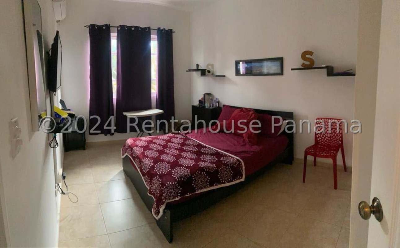 Bathroom with glass shower, beige tiles, modern vanity Costa del Este house Panama