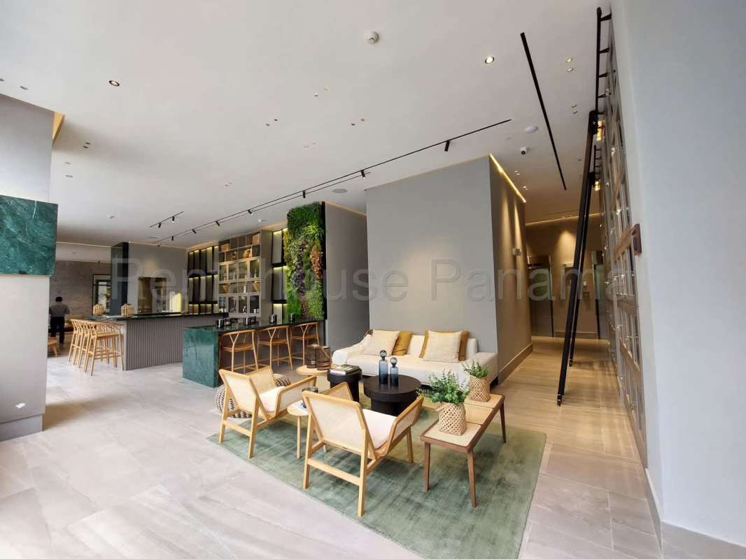 Contemporary kitchen with built-in appliances, quartz countertops at Ocean House Santa María apartment