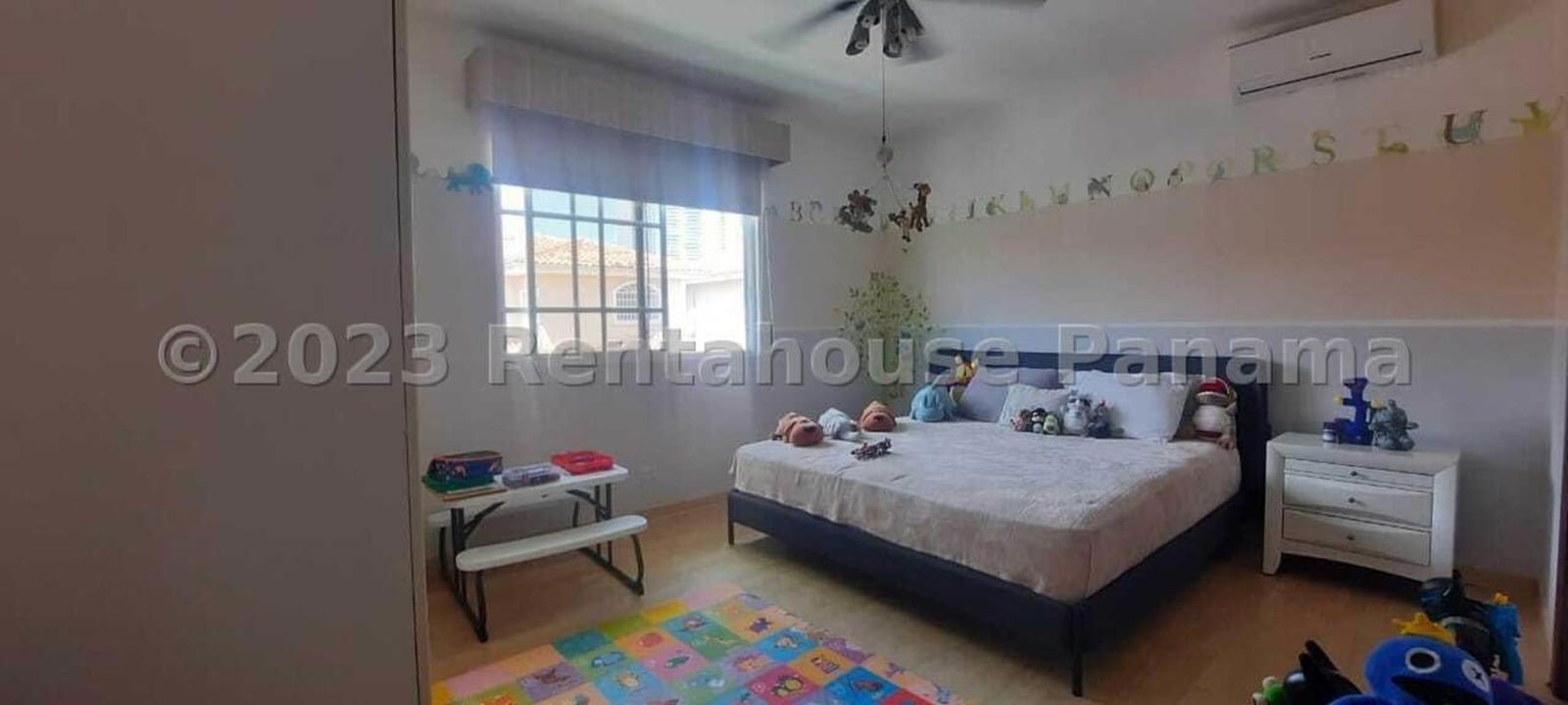 Spacious kids bedroom with large window playful decorations Costa del Este Panama luxury residence