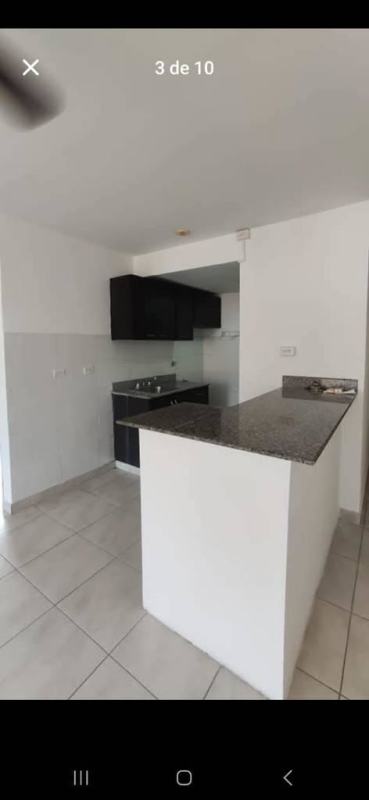 Kitchen with granite countertop and dark cabinetry Condado del Rey Panama