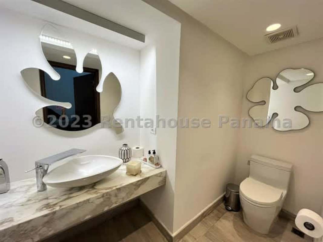 Large master bedroom with balcony access, natural light, luxury finishes in Costa Sur house Panama