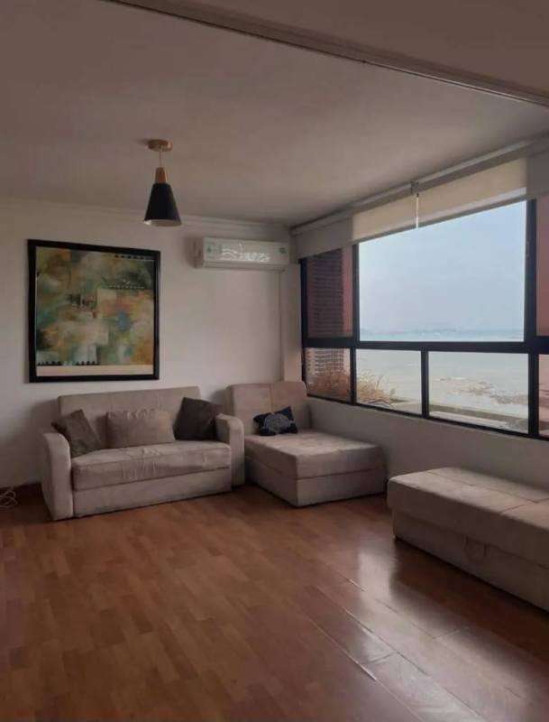 Living space with large windows overlooking Pacific coast from PH Bahía Balboa Panama