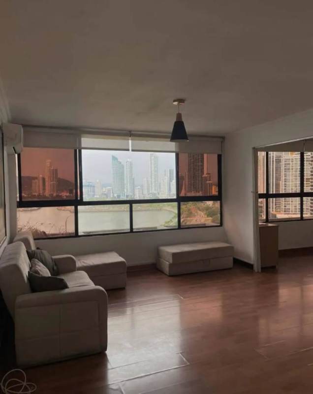 Cozy living space with ocean view windows at PH Bahía Balboa on Avenida Balboa Panama