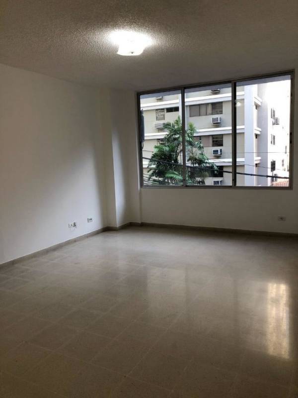 Modern bright living room with big windows and tiled floors for rent in Punta Paitilla Panama