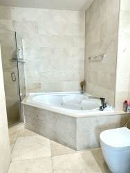 Luxurious living area with large windows and ocean view at PH Casa Bonita Veracruz