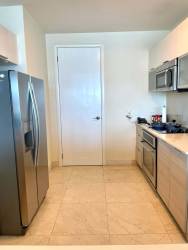 Elegant master bedroom with king bed, balcony access and ocean views in PH Casa Bonita