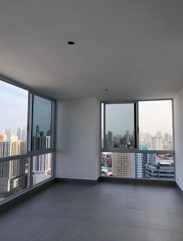 Modern bathroom with floating vanity and striped tile accent wall in PH Loma Vista Tower Panama
