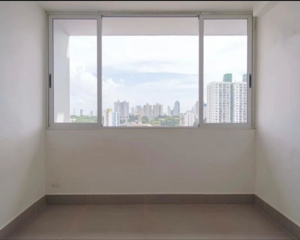 Modern kitchen with granite countertops, grey cabinetry and large windows PH Loma Vista Tower Panama