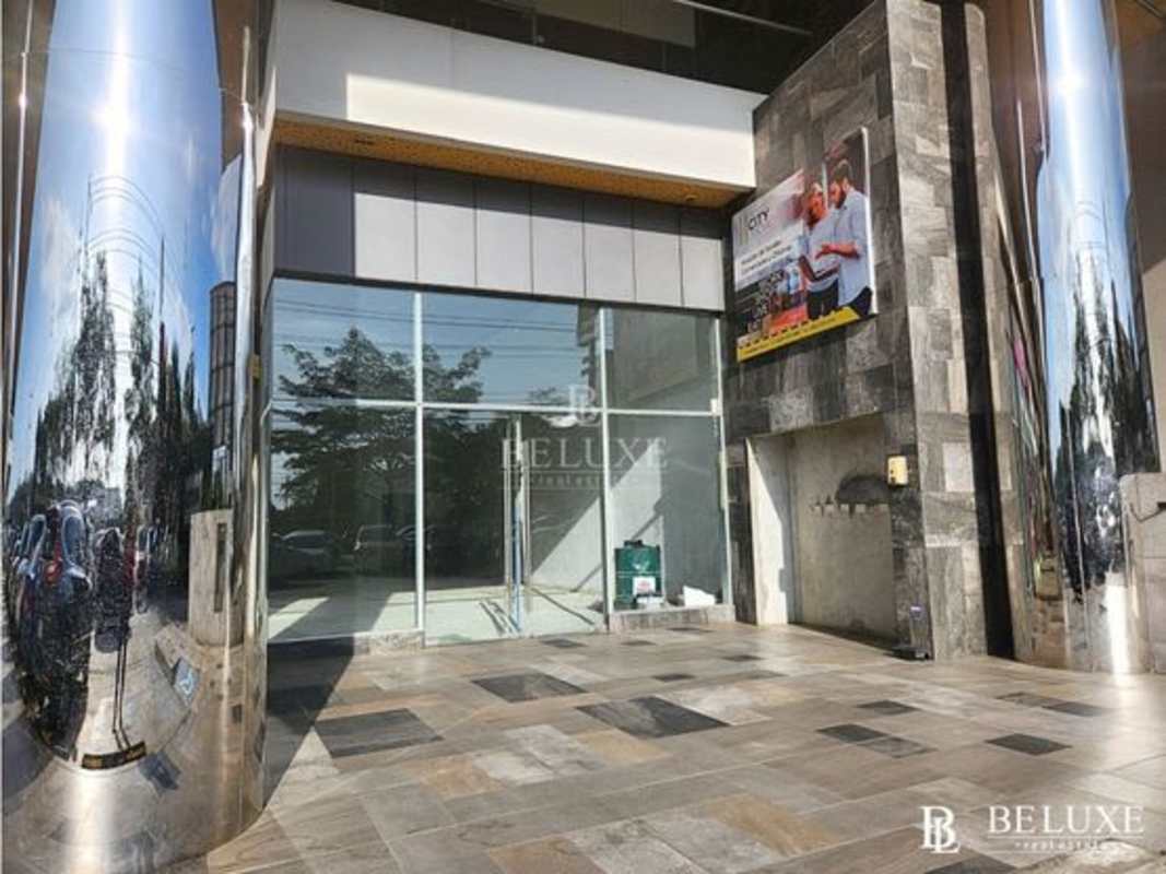 Raw shell commercial space interior unfinished with concrete floor and white walls, Dorado City Center Panama