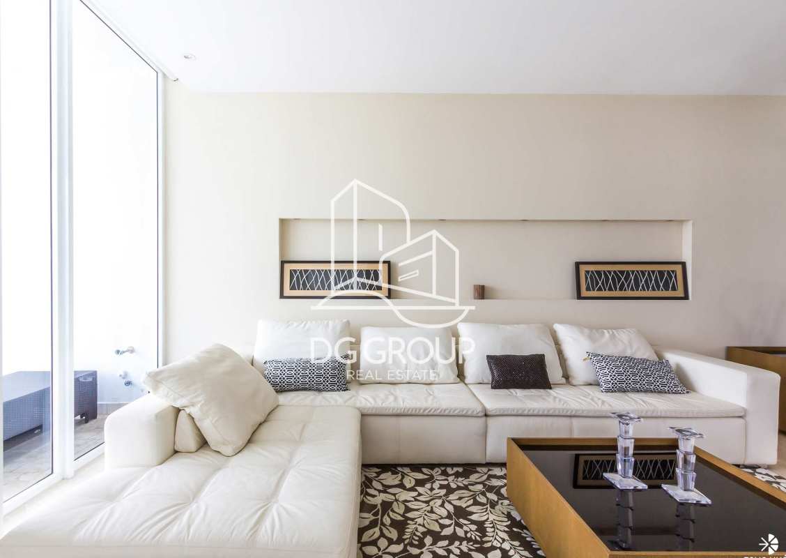 Open plan living dining space featuring marble floors and ocean views at PH The Point Punta Paitilla