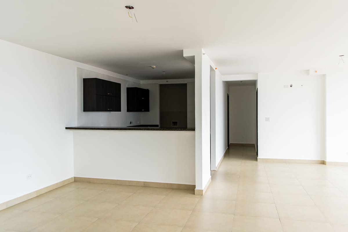 Spacious living dining area with tile flooring and large windows in Altos Tower, Condado del Rey