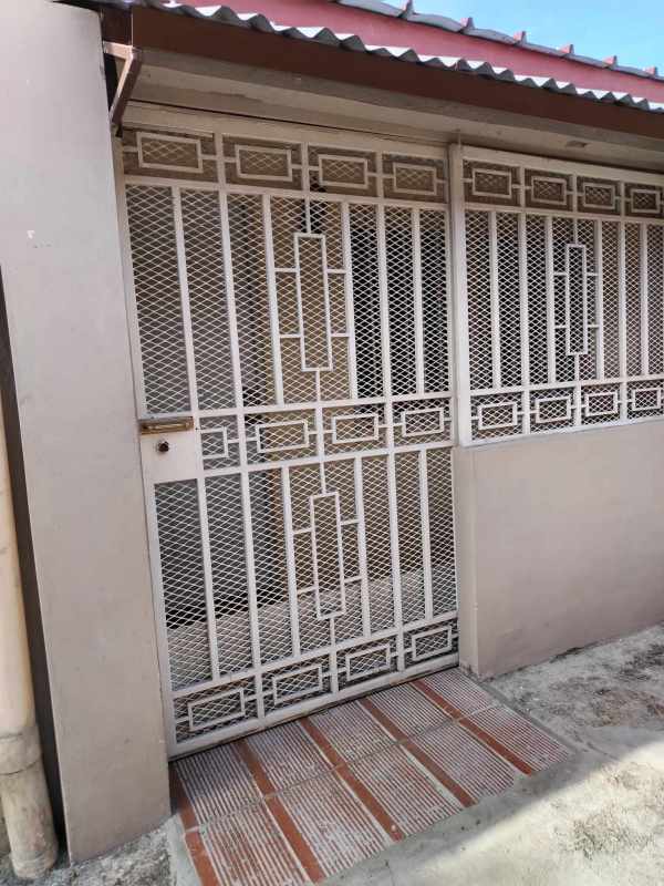 Compact kitchen with cabinets and double sink in Villa Flor apartment Panama City