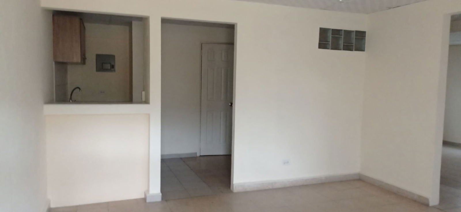 Open plan living and dining with pass-through window to kitchen Villa Flor Panama