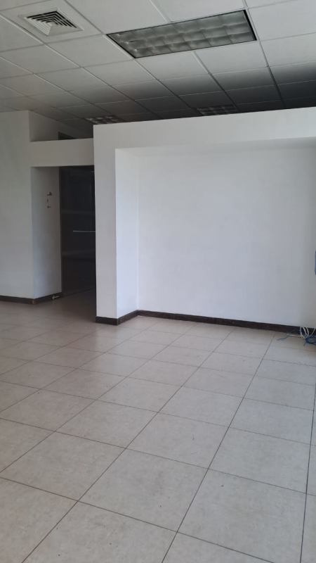 Empty interior commercial space with white walls and ceramic floor in PH Green Plaza