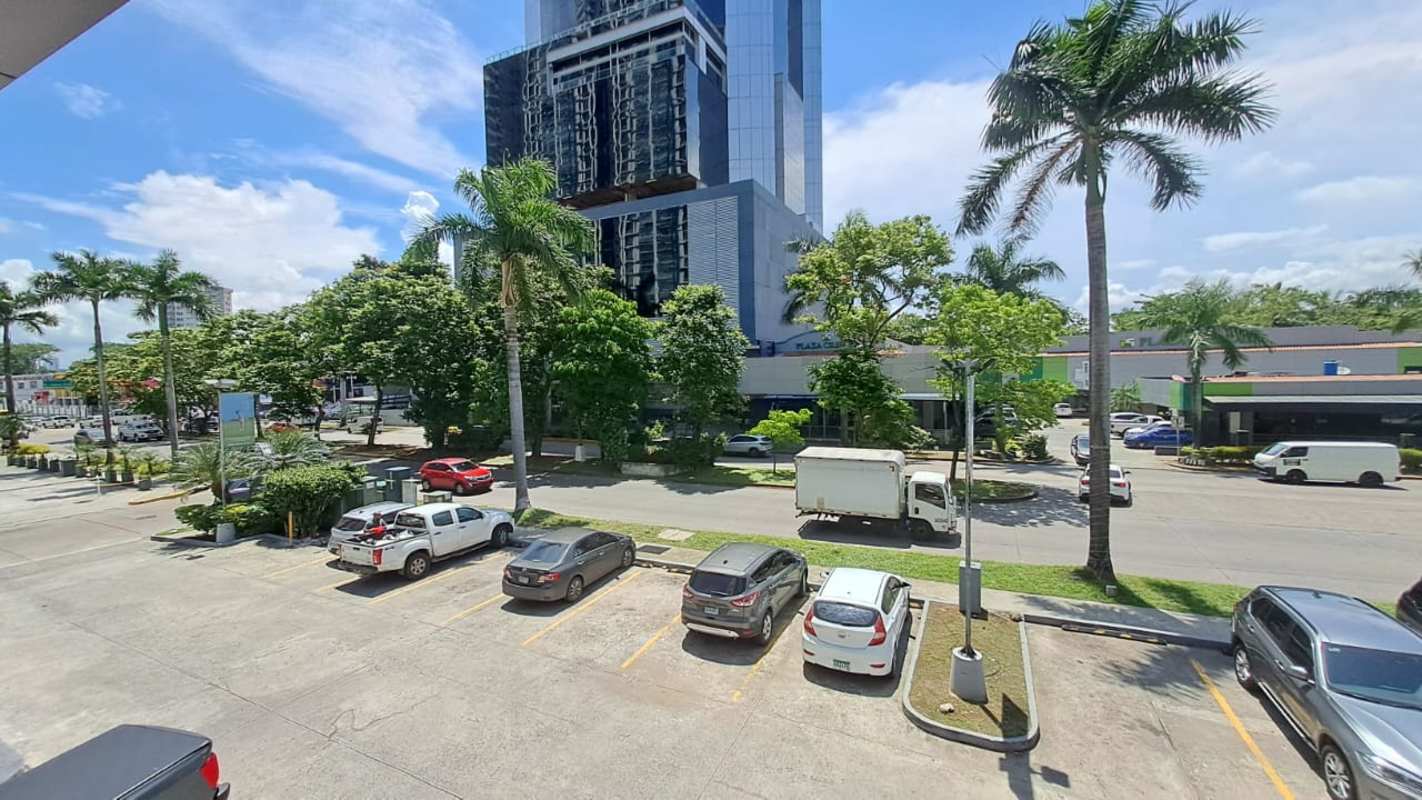 Ample parking with surrounding tower and palm trees in Costa del Este Panama