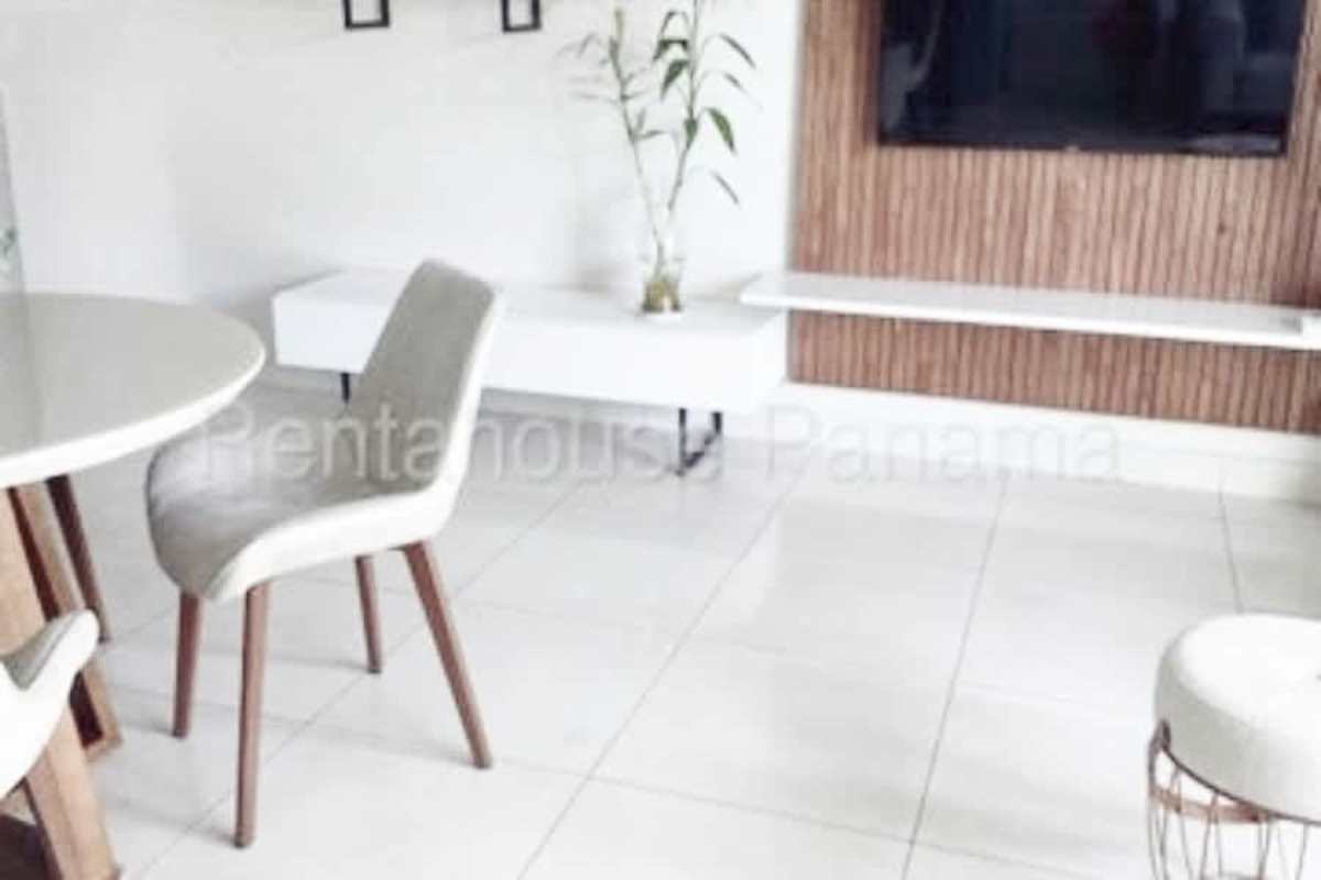 Living and dining room open layout in modern furnished apartment PH Coco del Mar Panama