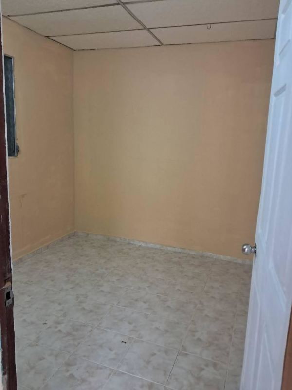 Basic empty room with drop ceiling beige walls ceramic floor Panama City