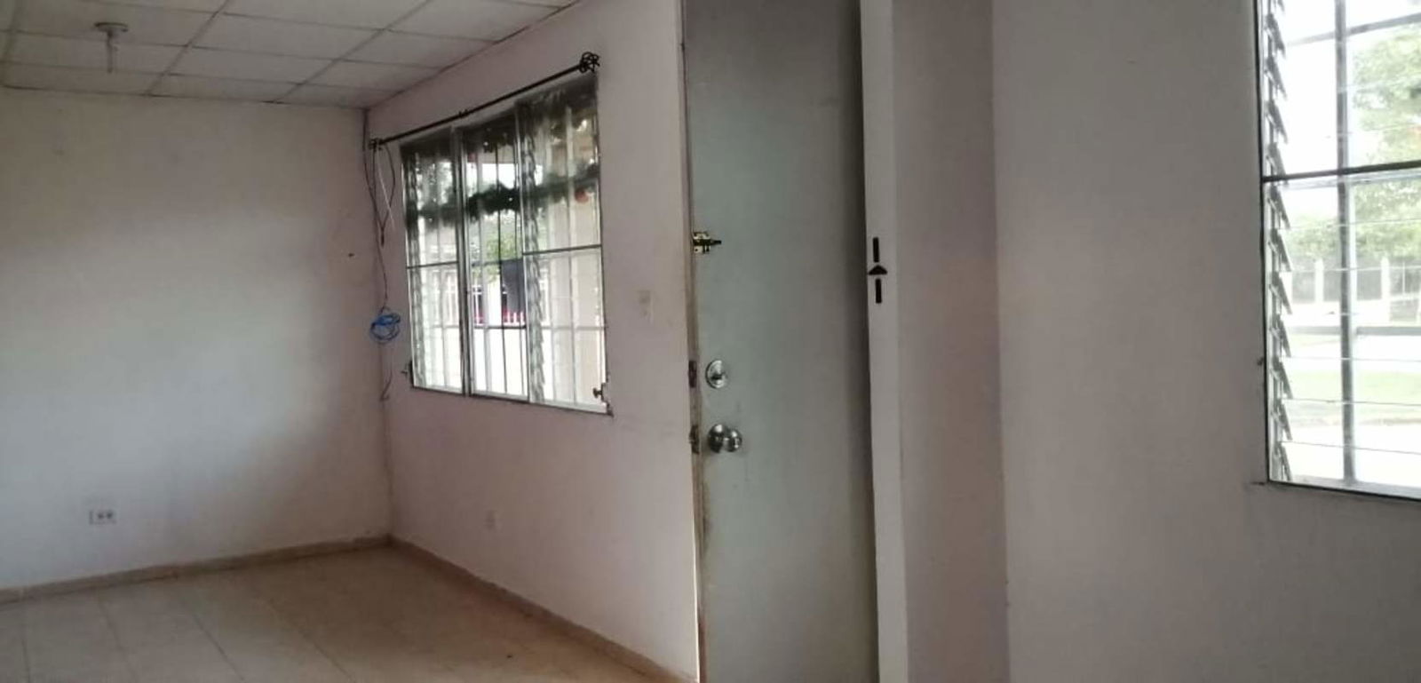 Basic kitchen granite countertop white cabinetry affordable house Pacora Panama